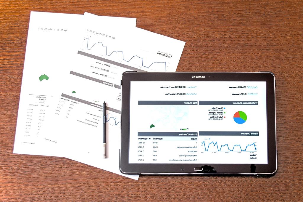 Primex Economic analysts discussing a report in a meeting room